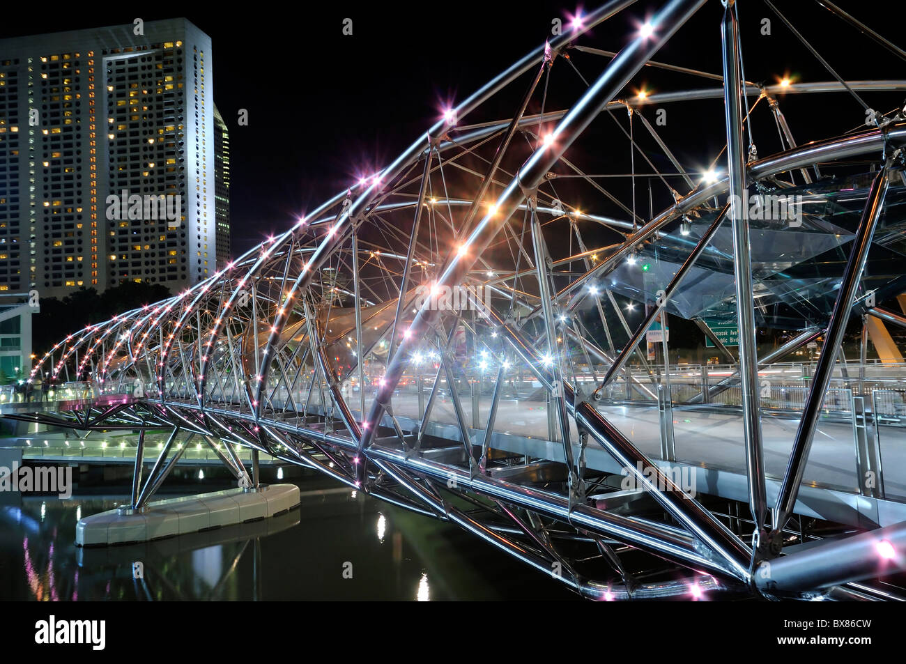 The iconic Double Helix Bridge in Singapore overlooking the Marina skyline. Stock Photo