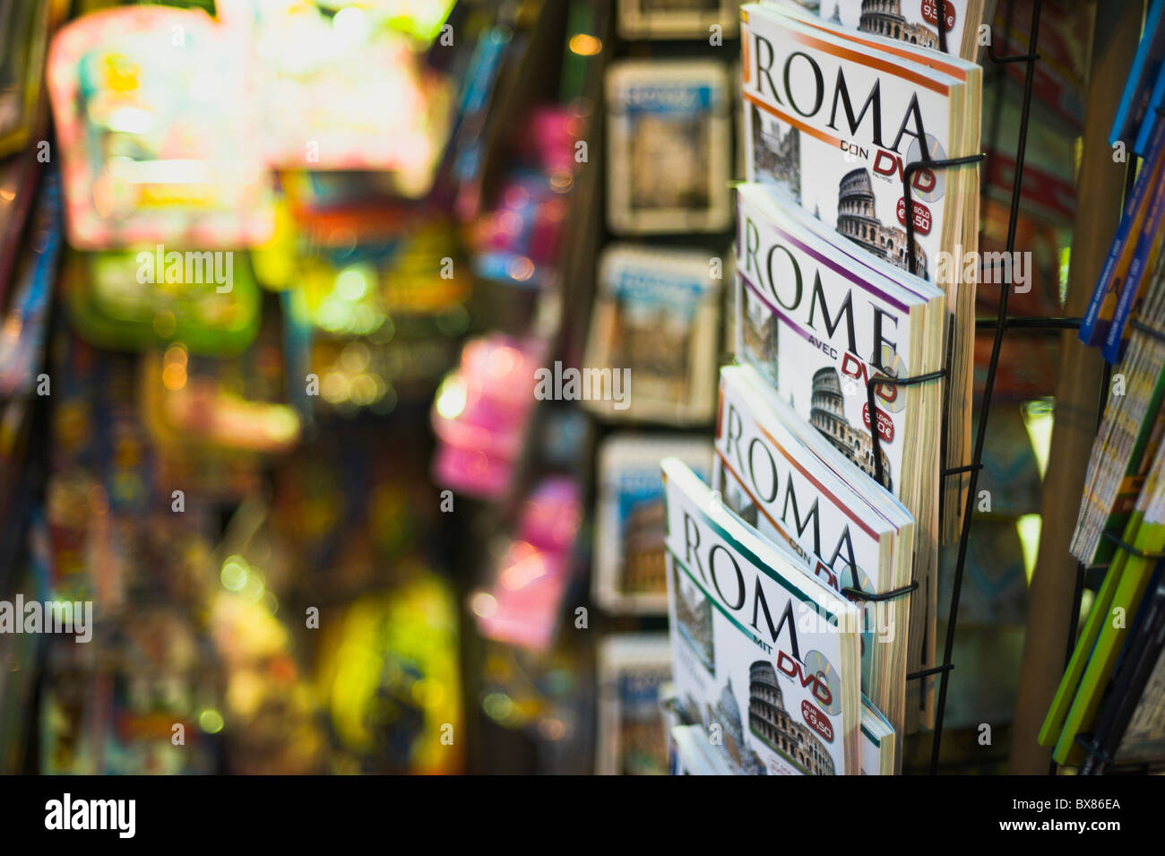 Night photo of Rome tourist guides for sale at a newsstand, shallow DOF Stock Photo