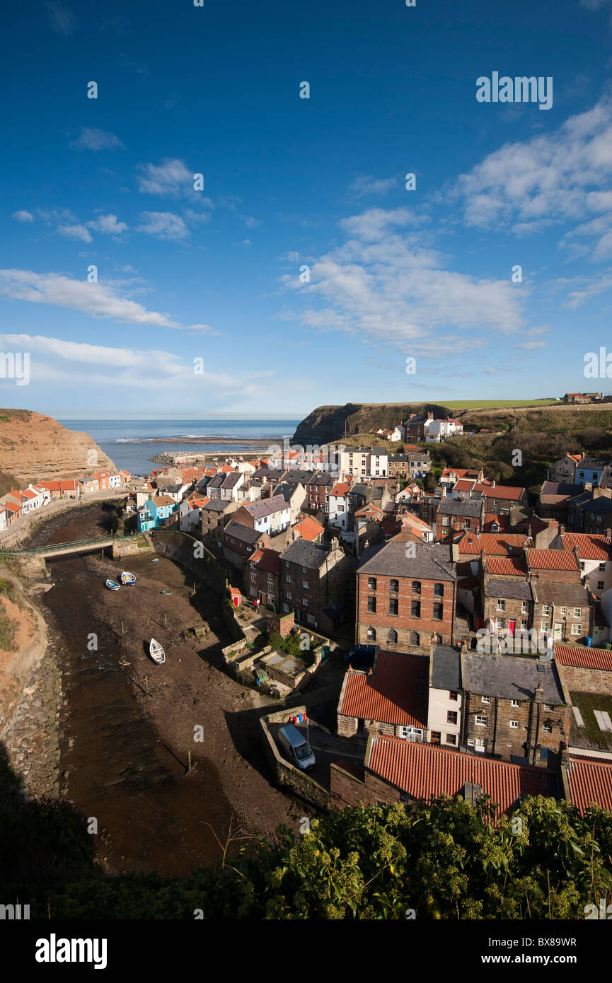 Staithes, on the East coast of Yorkshire, England, is a great place to visit on a sunny day. The River Esk flows through the town to the sea. Stock Photo