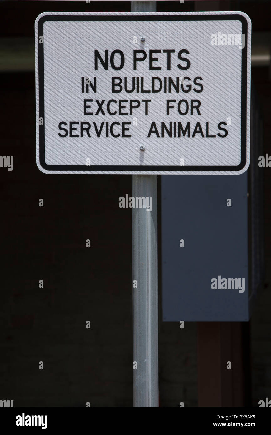 Signs explain rules for entering rest facilities or stops along American  freeways. Stock Photo