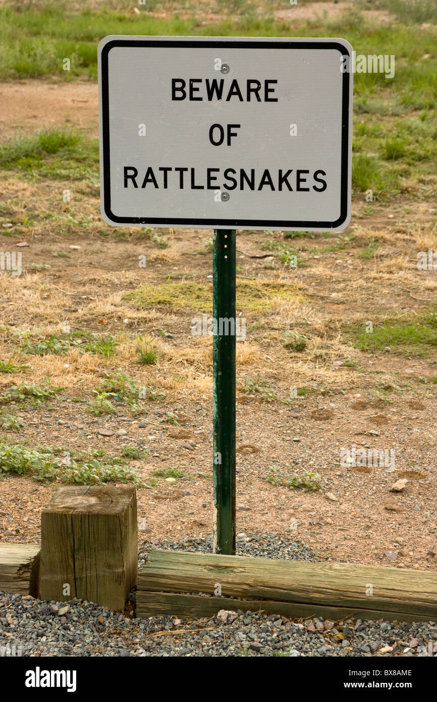 Rattlesnake warning signs explain the dangers of a walk about. Please