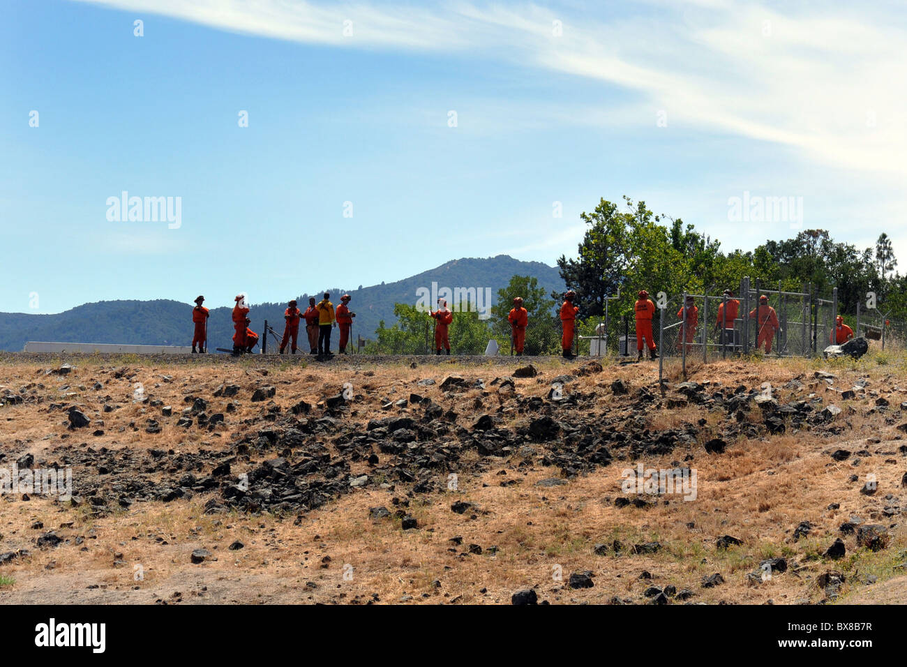 Prisoners repair a road as part of their rehabilitation back into the community, North California, USA Stock Photo