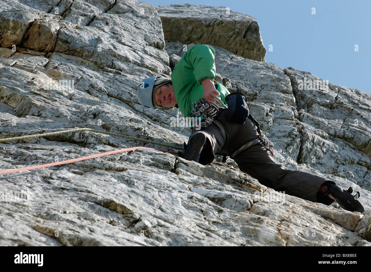 A rock climber on Breaking the Barrier, E1 5b, Holyhead Mountain. Stock Photo
