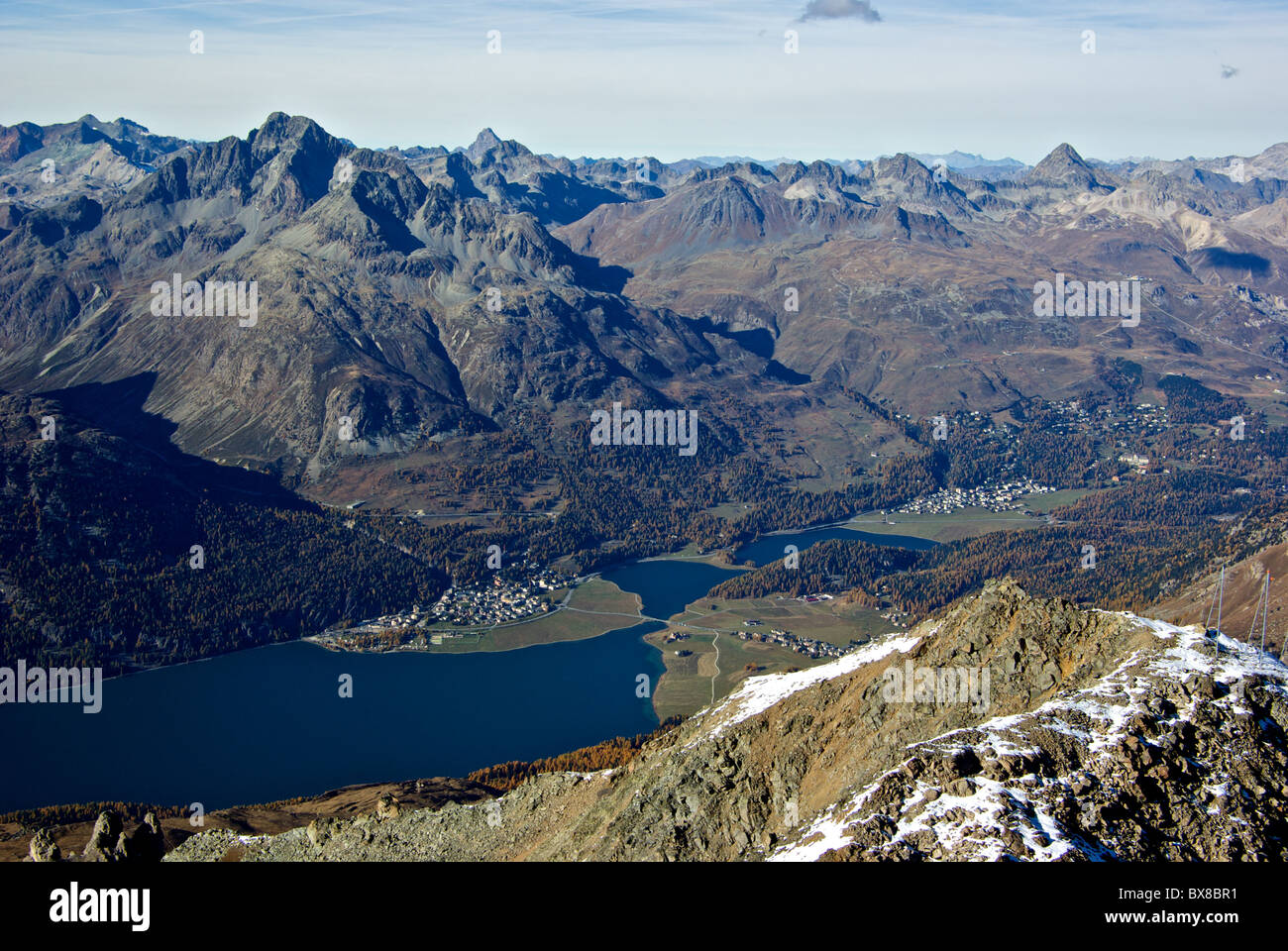View from Mount Corvatsch to Lake Silvaplana and rugged mountain range to north in Saint Moritz valley Switzerland Stock Photo
