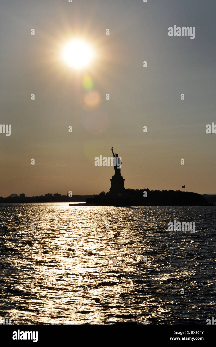 Statue of Liberty at sunset, Manhattan New York City USA Stock Photo