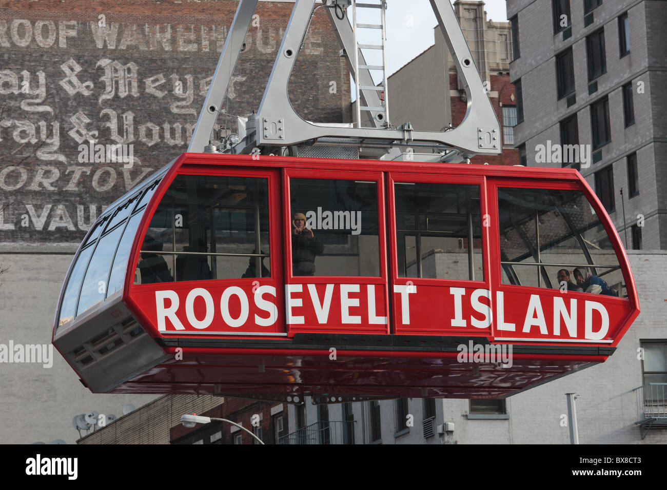 The Roosevelt Island Tram approaches the Manhattan station in New York City. Stock Photo