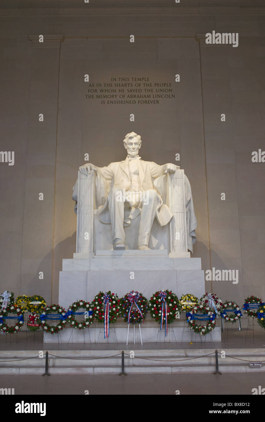 The statue of Abraham Lincoln inside the Lincoln Memorial decorated with flowers for Presidents Day in Washington, DC. Stock Photo