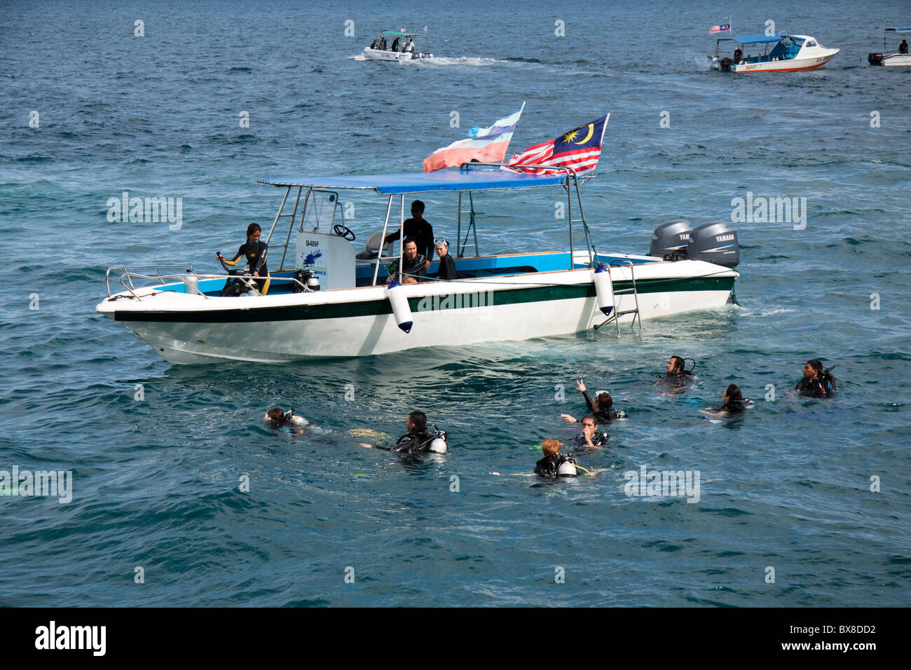 Dive boats and scuba divers, Borneo, Malaysia Stock Photo Alamy