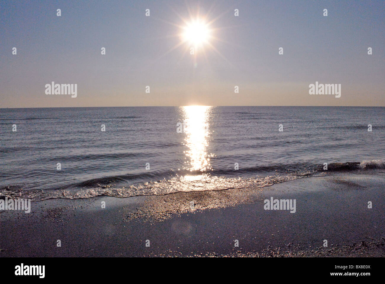 rays of sun on the calm sea Italian Stock Photo - Alamy