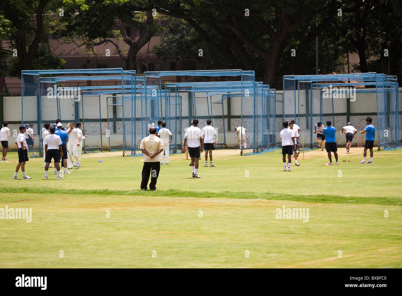 Talented Indian cricketers train in the nets at the National Cricket Academy in Bengaluru, India. Stock Photo