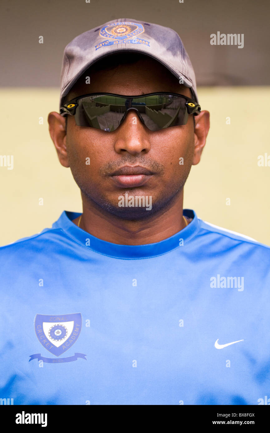 An Indian cricket coach at the National Cricket Academy in Bengaluru, India. Stock Photo