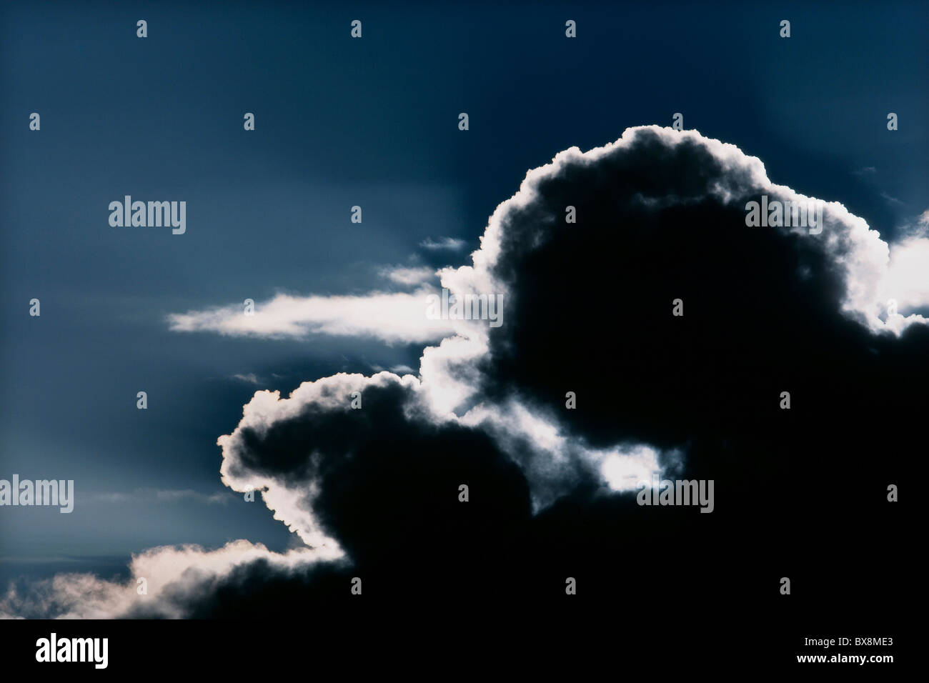 Sunlight shining through black cloud creating silver lining, East