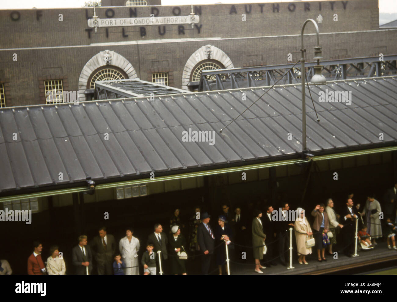 Original 1960's image of people waiting to board a passenger ship at Tilbury Docks, Essex. Stock Photo