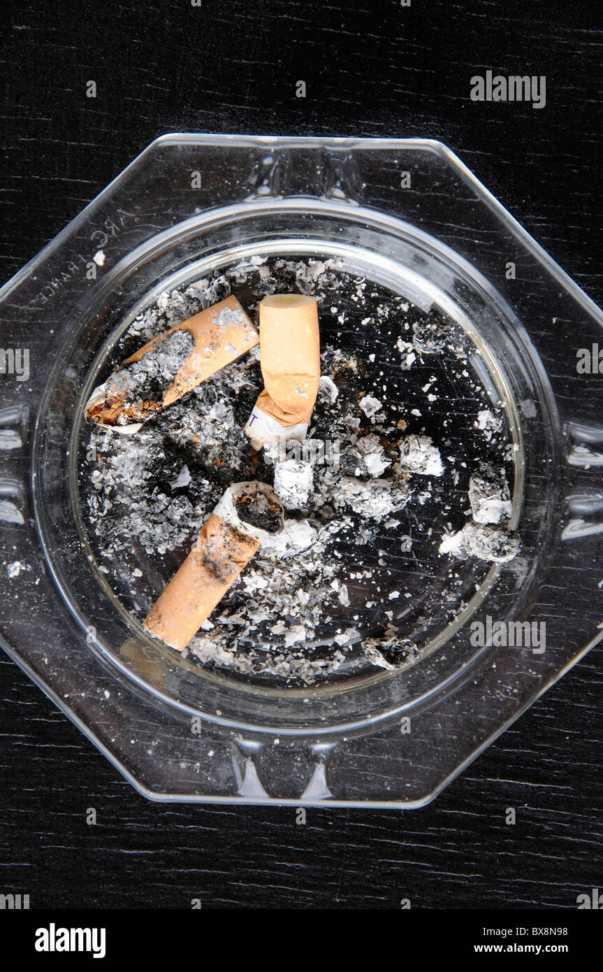 Ash tray and filter tipped cigarettes Stock Photo Alamy