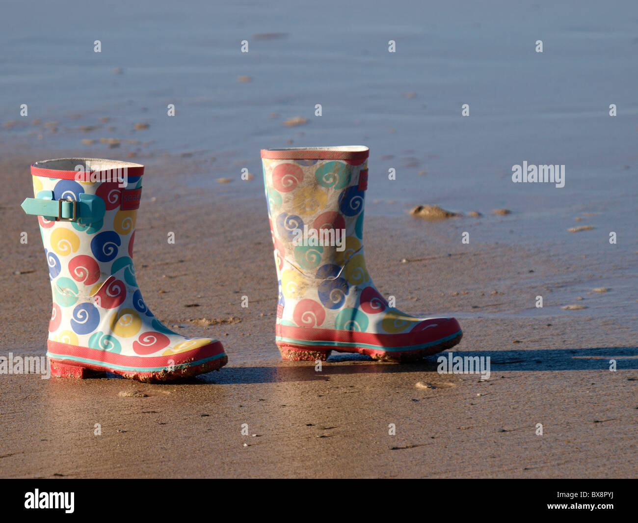 A pair of children's wellies at the beach, Cornwall, UK Stock Photo Alamy