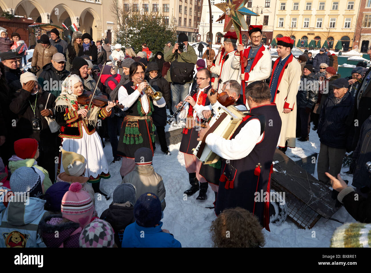 Poland Krakow Folk Musicians dressed in Traditional Polish Costume performing during Szopki crib making contest December 2010 Stock Photo