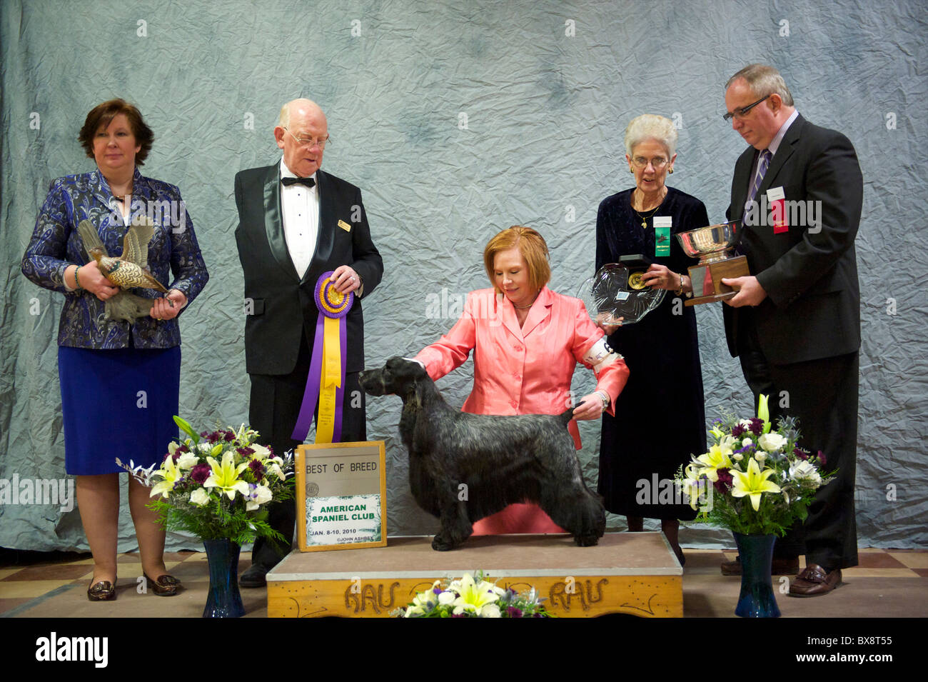 Judges and officials pose with champion dog during the ASC Flushing