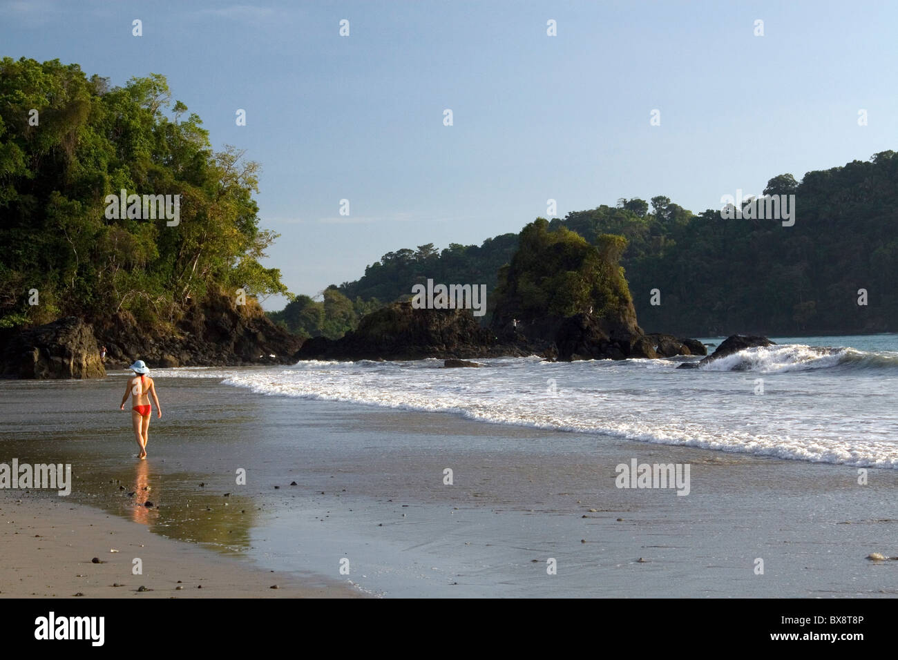 Woman walking on the beach at Manuel Antonio National Park in Puntarenas province, Costa Rica. Stock Photo