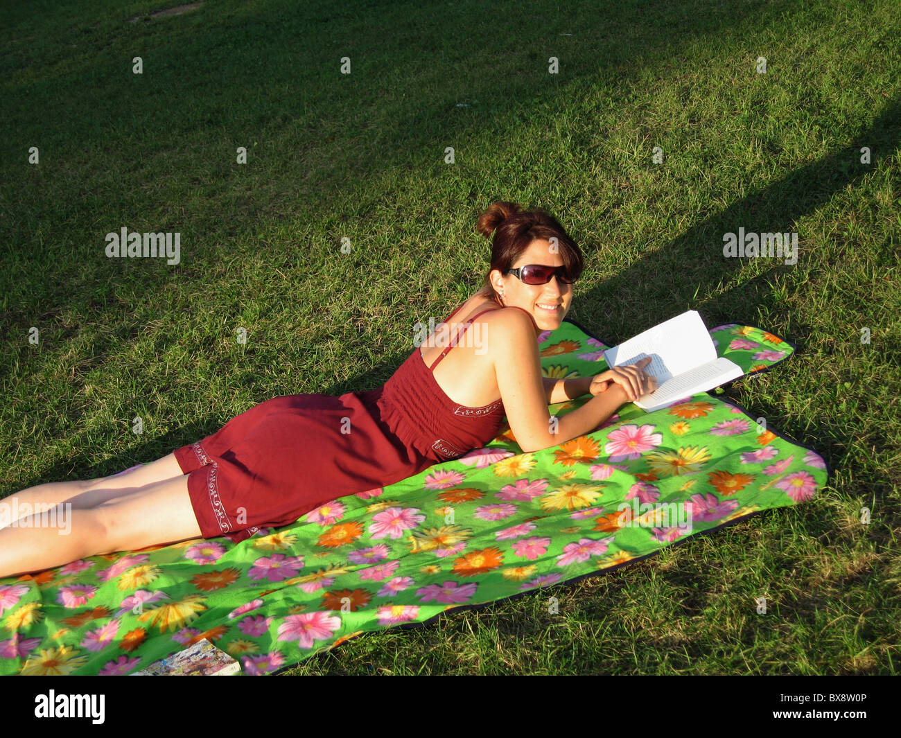 Pretty young girl relaxing in a park Stock Photo