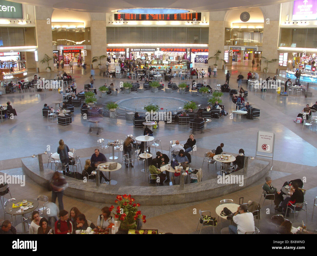 Passengers sit at the Airside duty-free rotunda of terminal 3, in Ben Gurion Airport widely known as Lod Airport in Israel Stock Photo