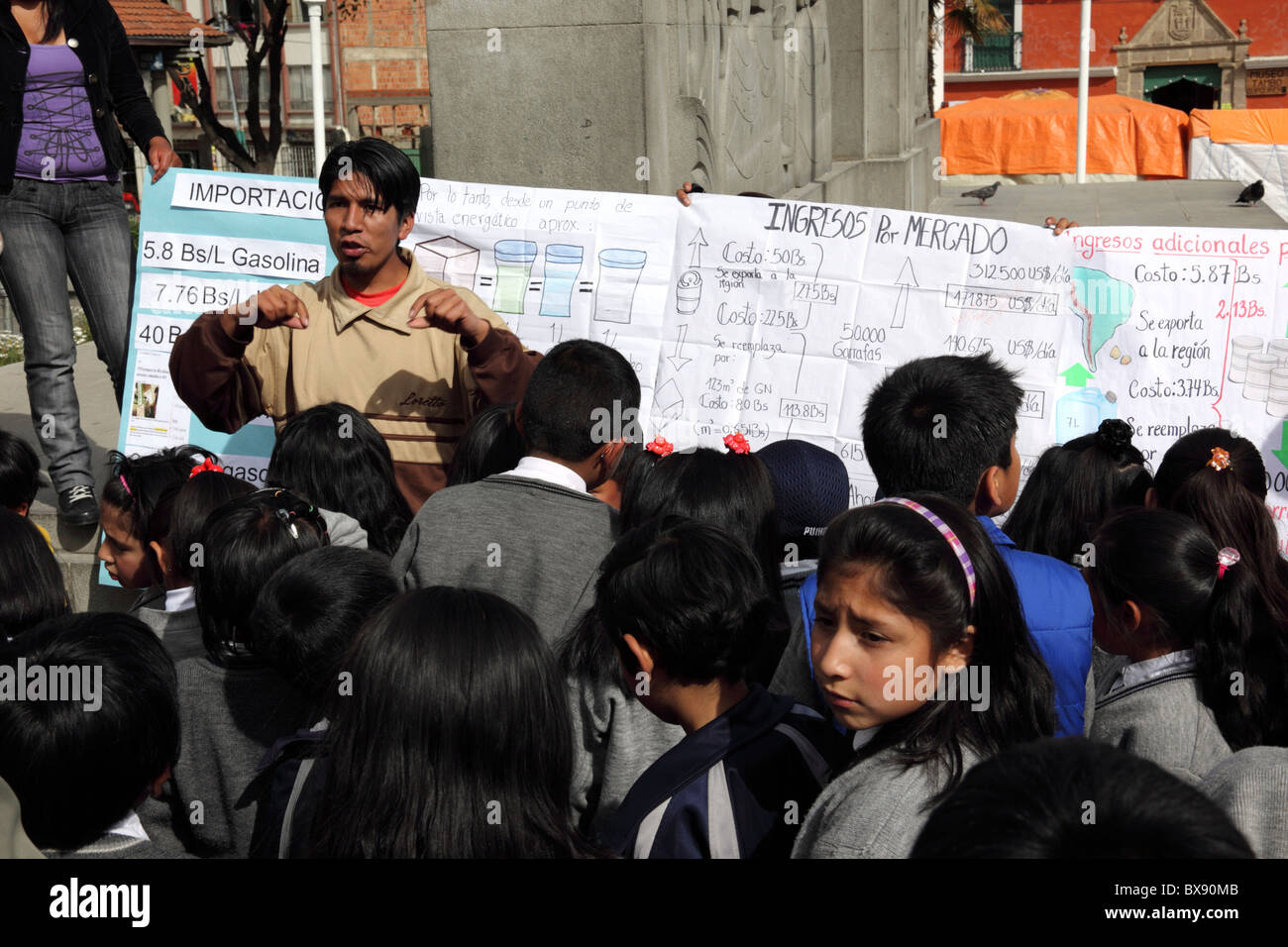 Teacher explaining benefits of nationalising the country's natural gas