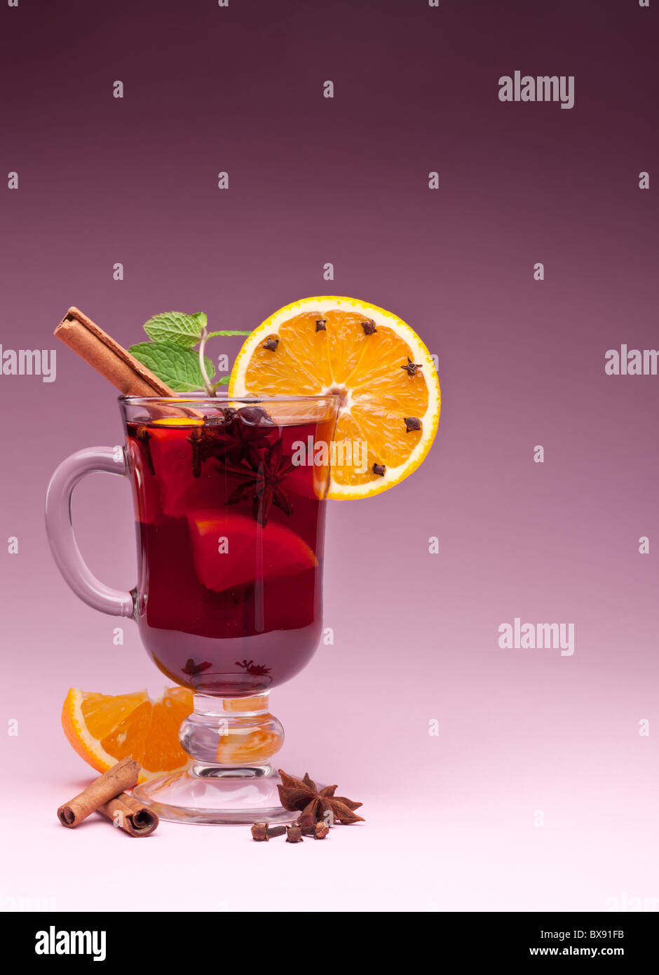 glass of mulled wine on a pink background Stock Photo