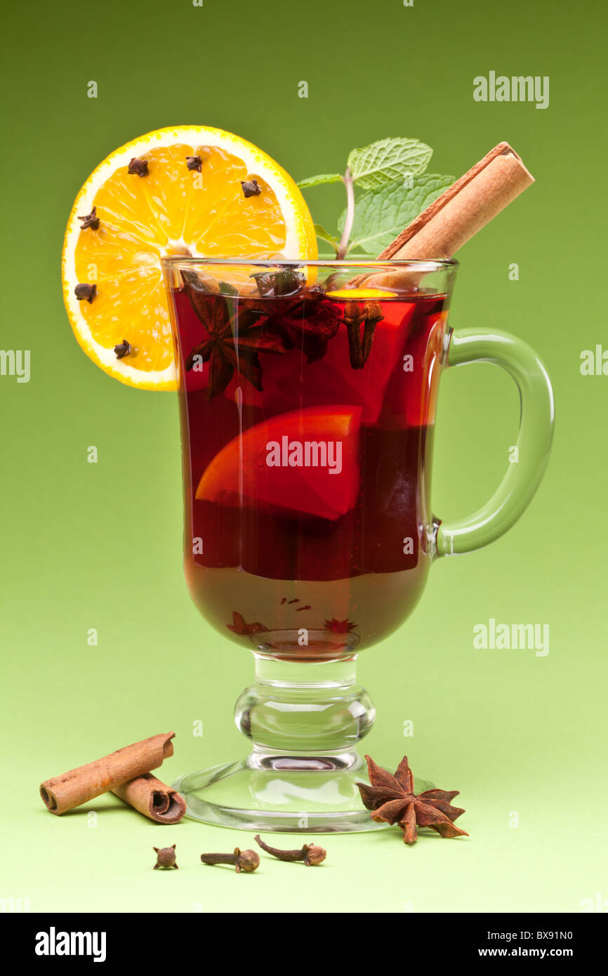 glass of mulled green on a green background Stock Photo