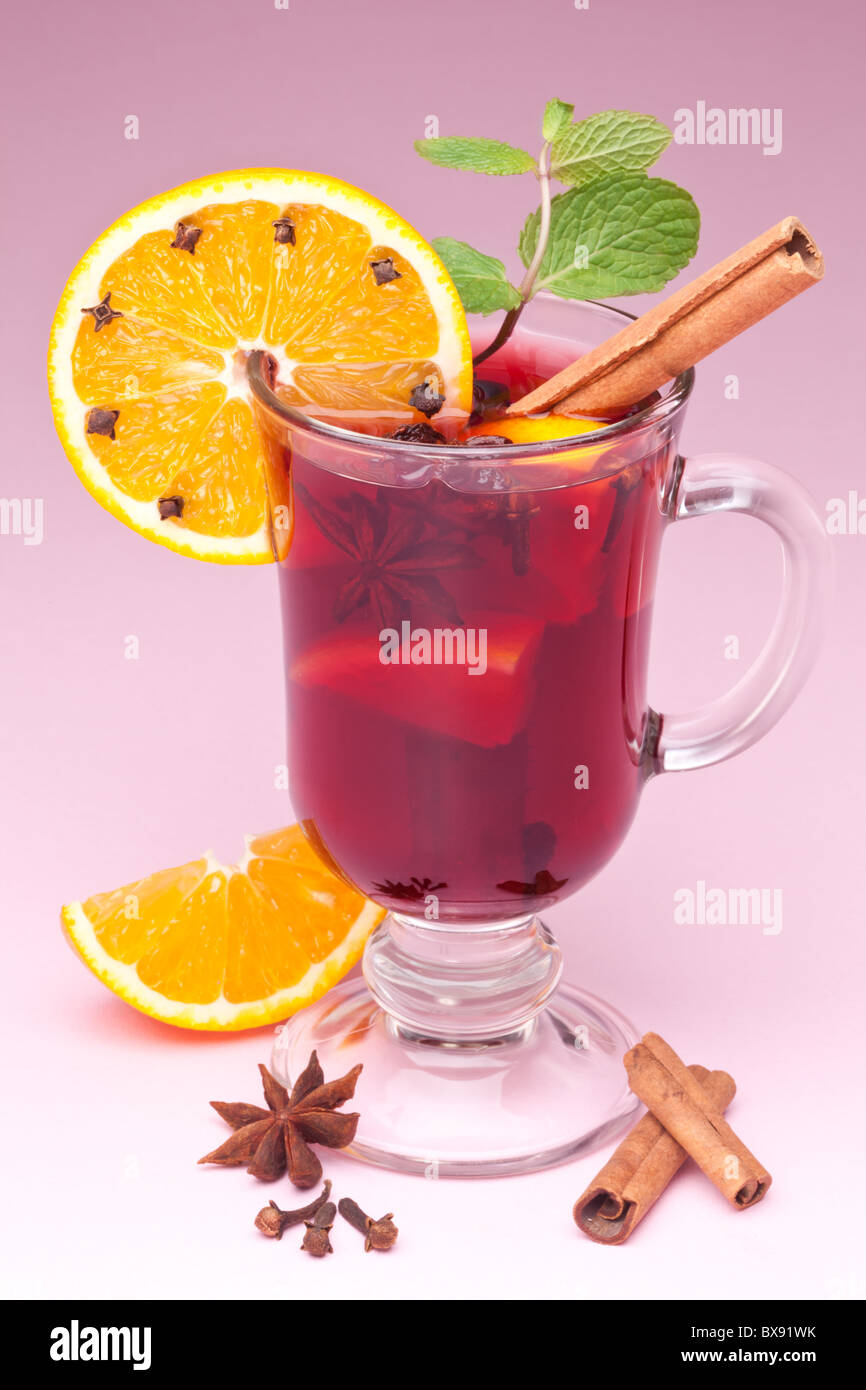 glass of mulled wine on a pink background Stock Photo