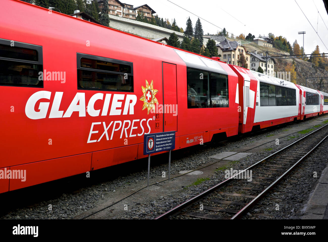 Panoramic railcars electric powered train Rhaetian Railway  Glacier Express train station St. Moritz Stock Photo