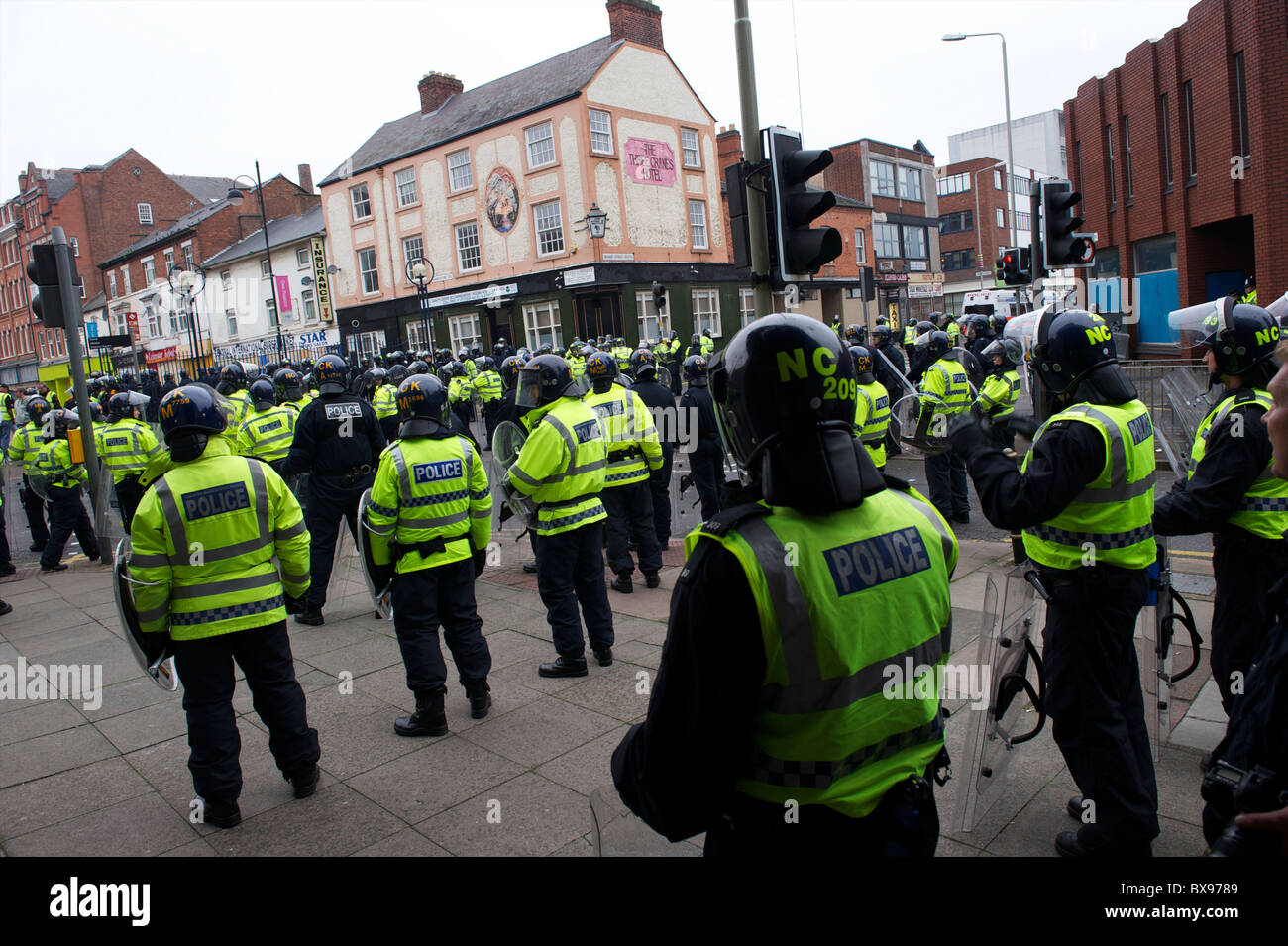 A phalanx of police officers, numbering in excess of 1,400, equipped ...