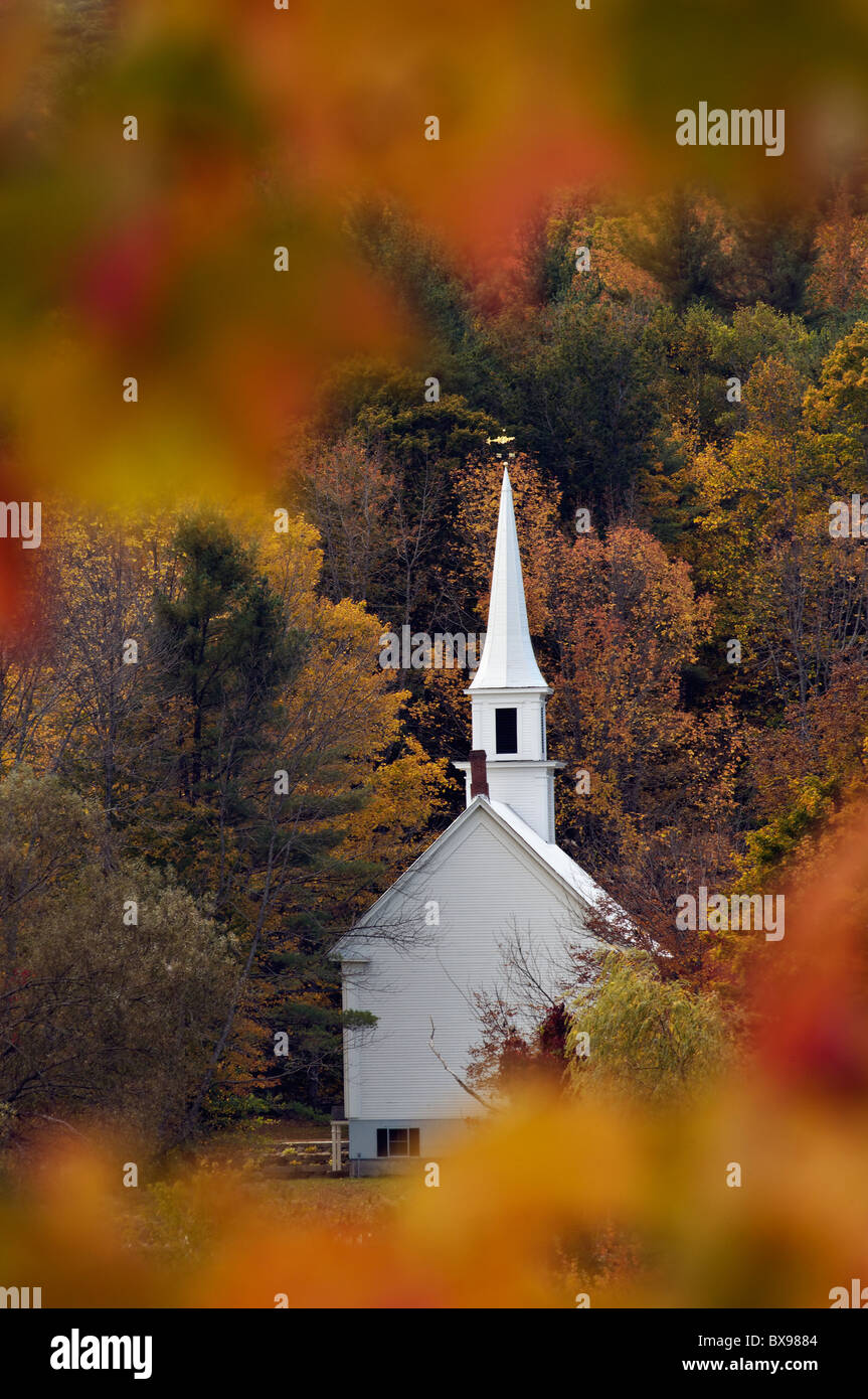 Little White Church Seen through Autumn Leaves in Eaton Center, New Hampshire Stock Photo