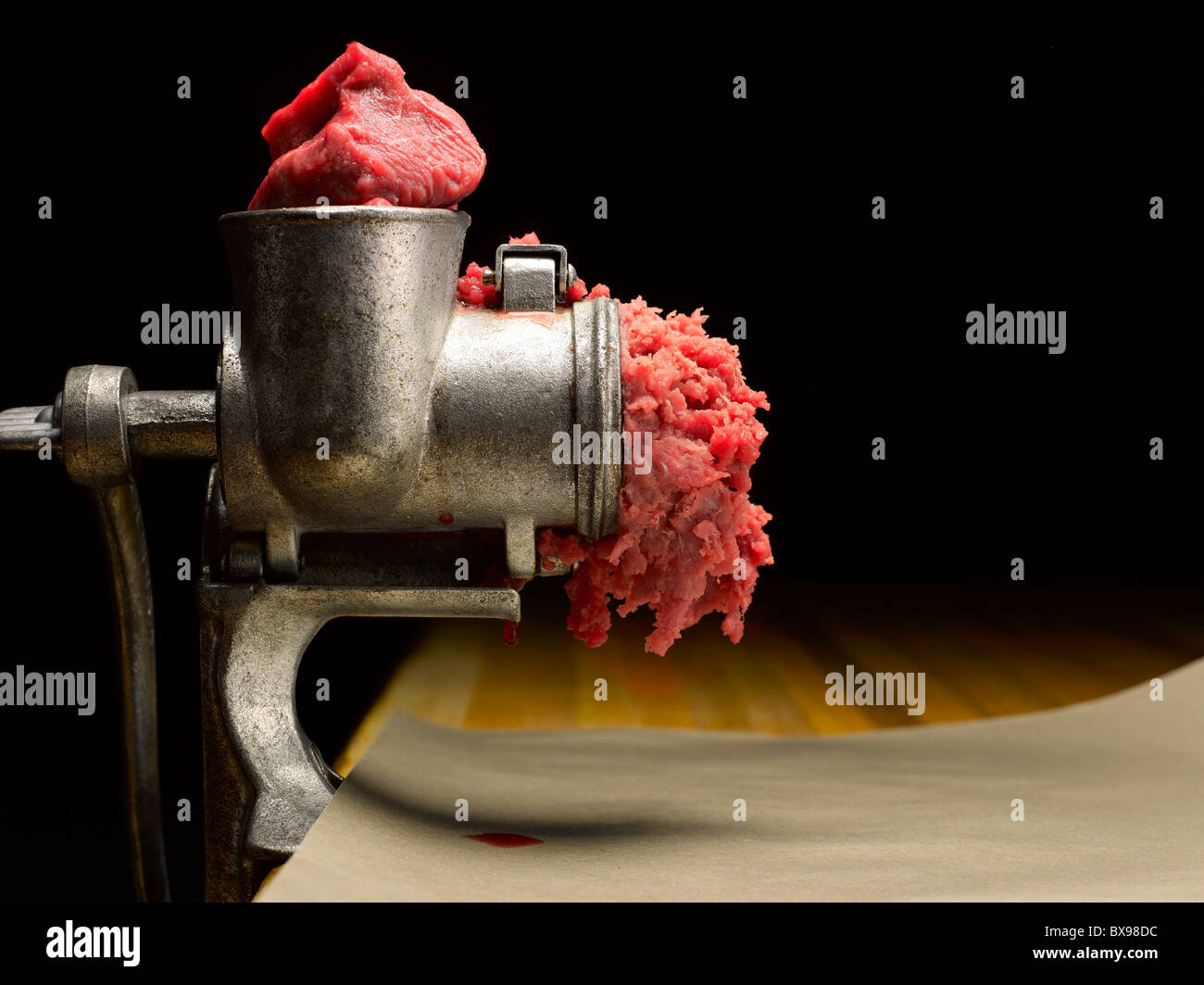 Freshly ground meat coming out of a meat grinder - Stock Image - F017/6580  - Science Photo Library