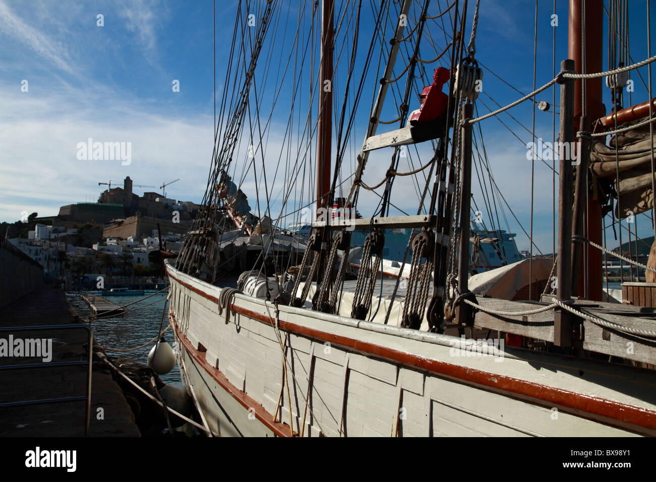 Partial view of a shooner (Tall Ship) moored at the harbor of Ibiza, Spain Stock Photo