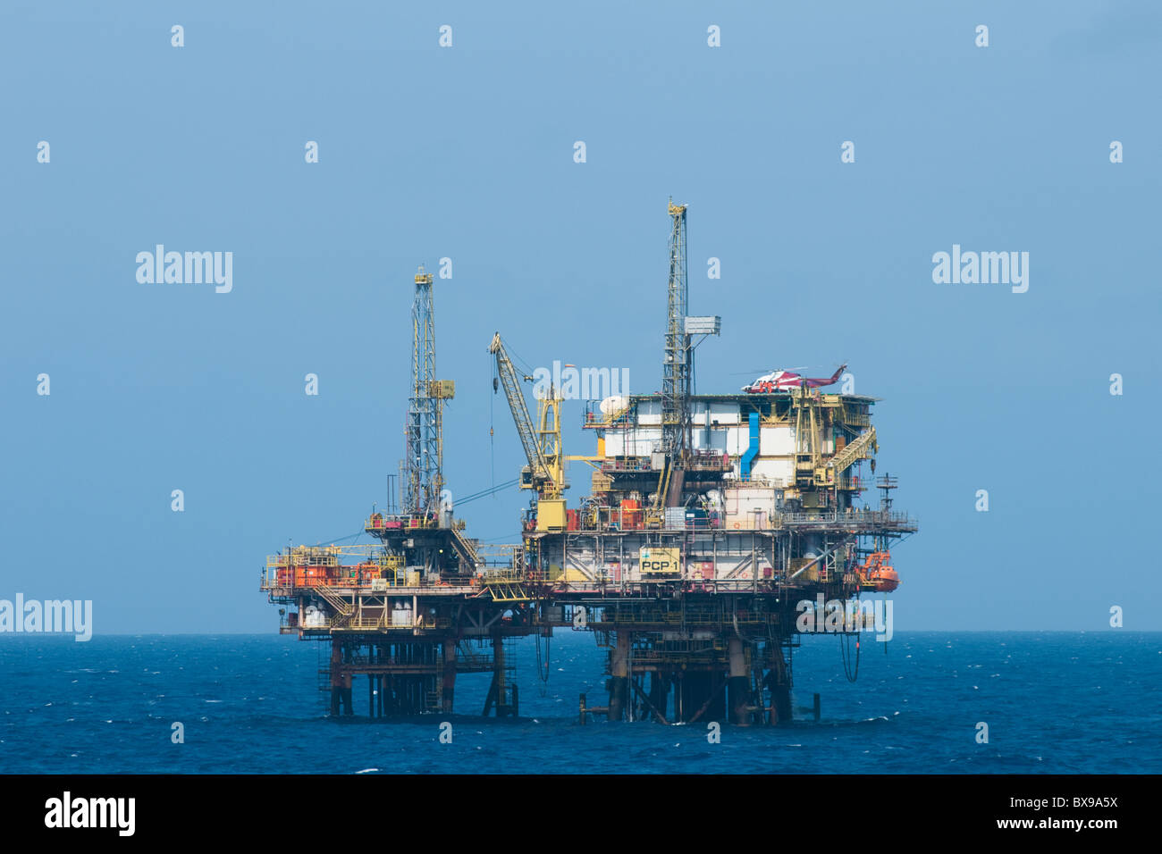 PCP-1 oil rig from Petrobras brazilian oil company. Helicopter landed on helipad. Stock Photo
