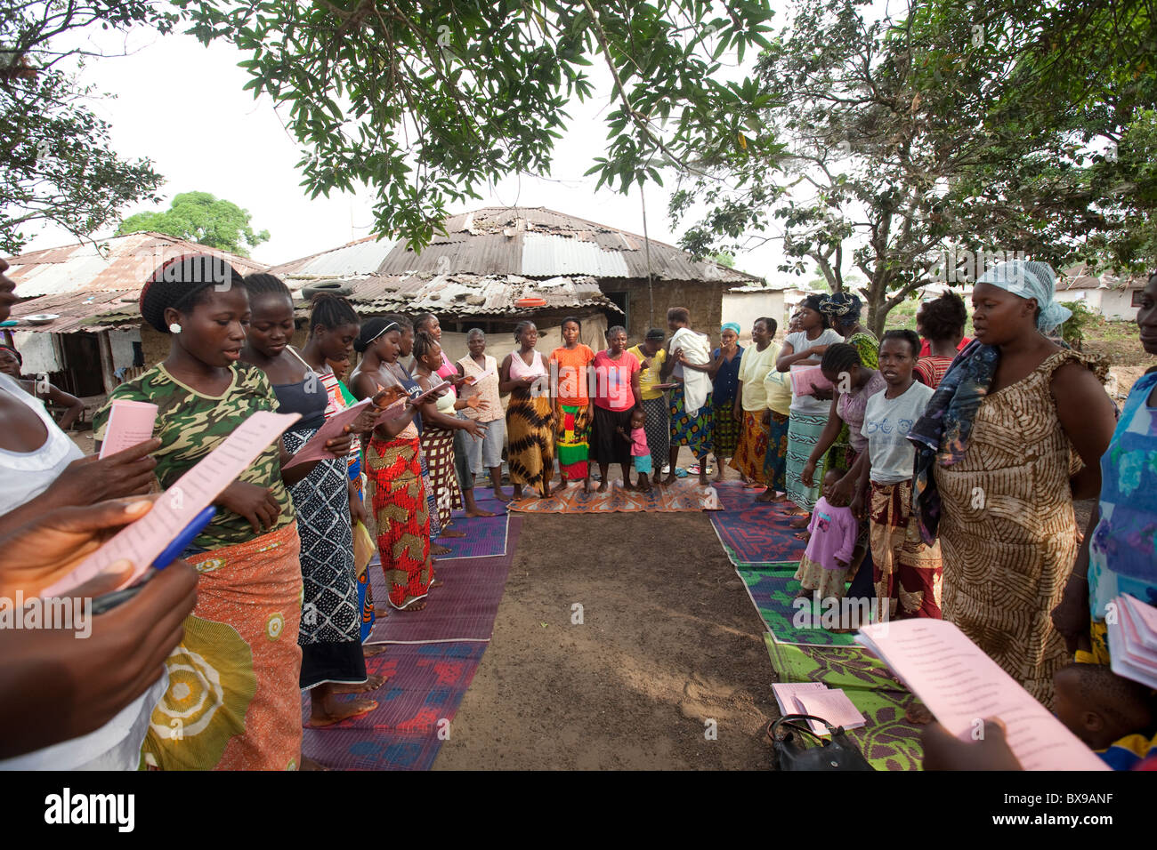 Women attend a community microfinance meeting in Kakata, Liberia, West Africa. Stock Photo