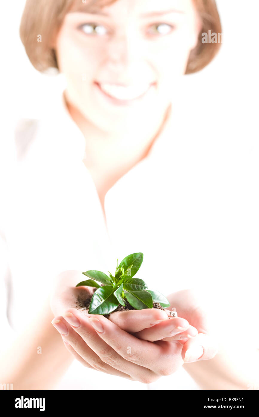 Image of woman holding the plant in her palm Stock Photo - Alamy