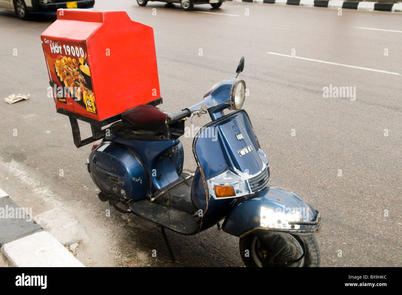 Fast food delivery on a scooter Stock Photo Alamy