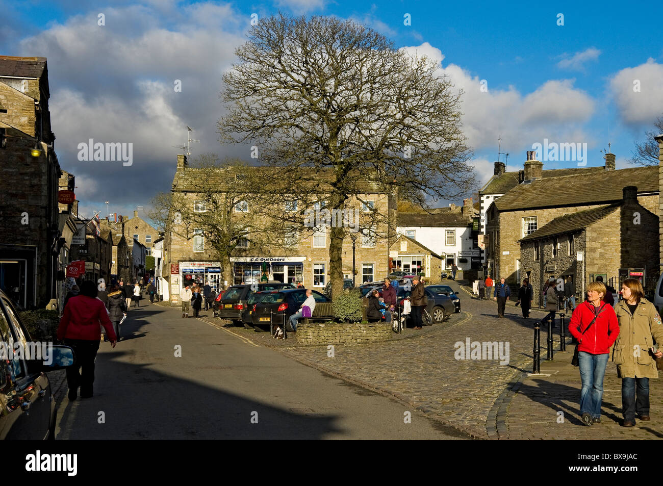 People tourists visitors in Grassington village Yorkshire Dales in winter Upper Wharfedale North Yorkshire England UK United Kingdom GB Britain Stock Photo