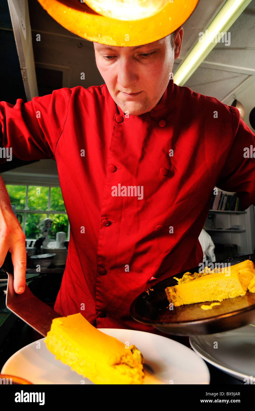 chef in red overalls in a pub kitchen Stock Photo - Alamy