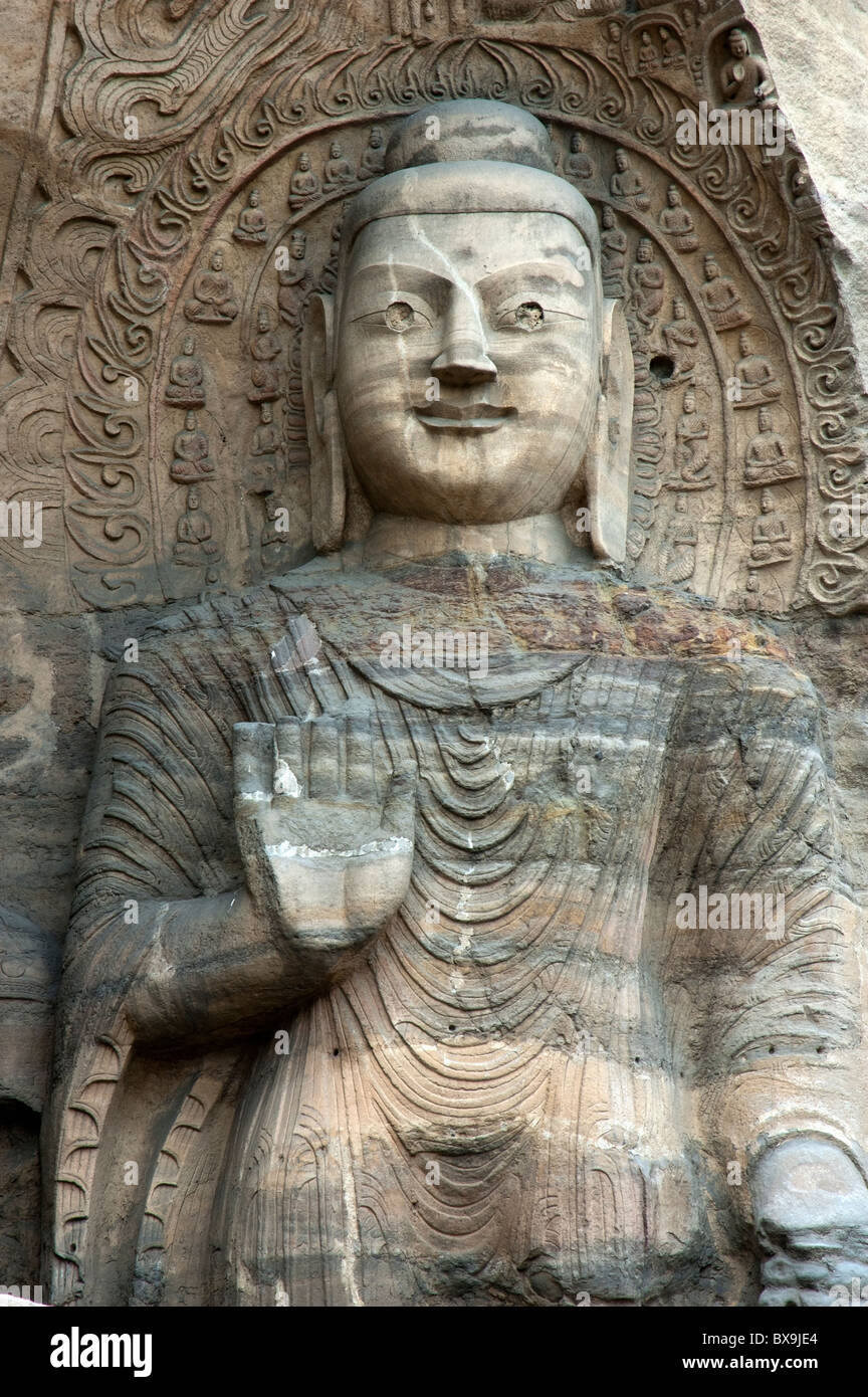 Giant Buddha statue carved inside the ancient Yungang Grottoes, Datong ...