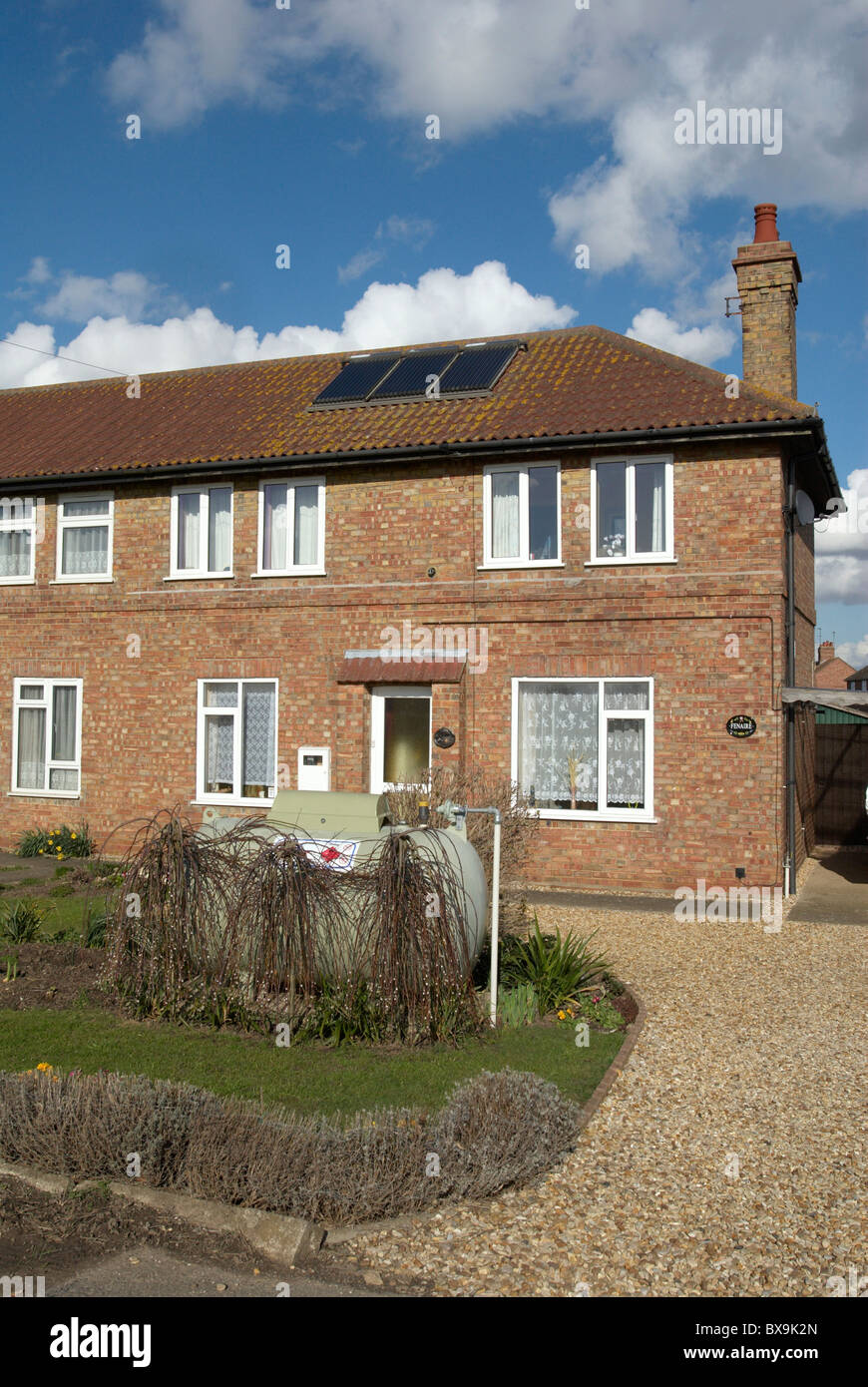 Semi-detached home with solar panels and oil heating Norfolk UK Stock Photo