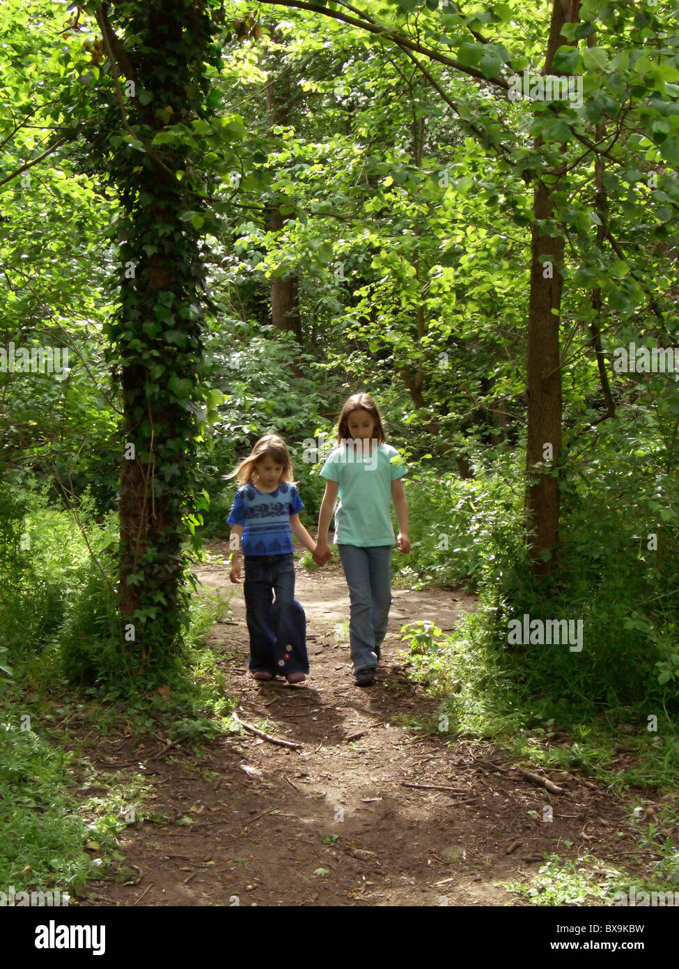 Two girls walking through forest hi-res stock photography and images ...