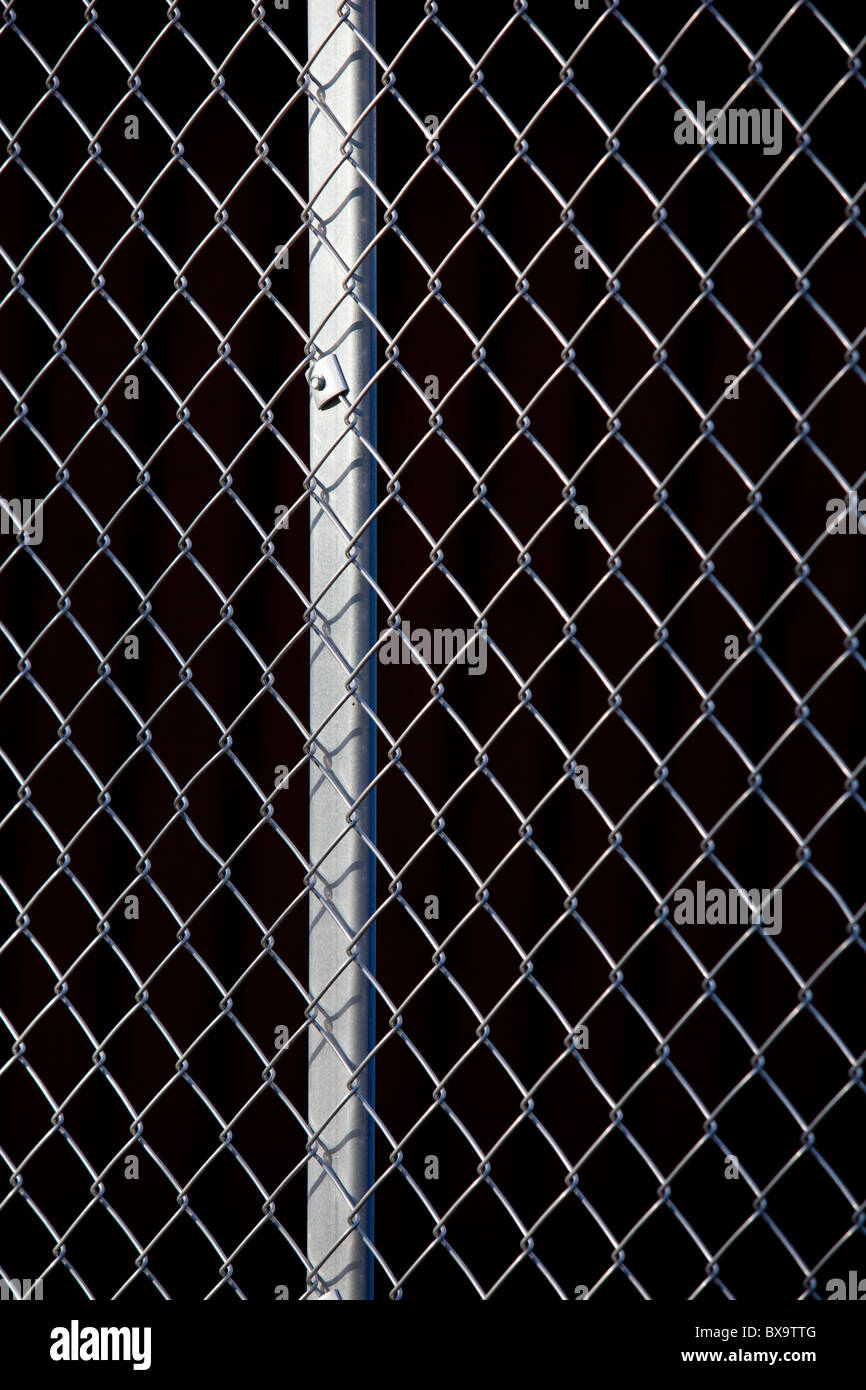 Metallic wire netting fence Stock Photo