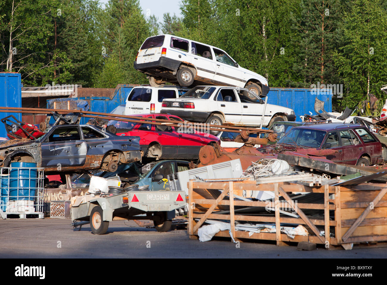 Inventory pile of cars at scrapyard waiting for recycling , Finland Stock Photo