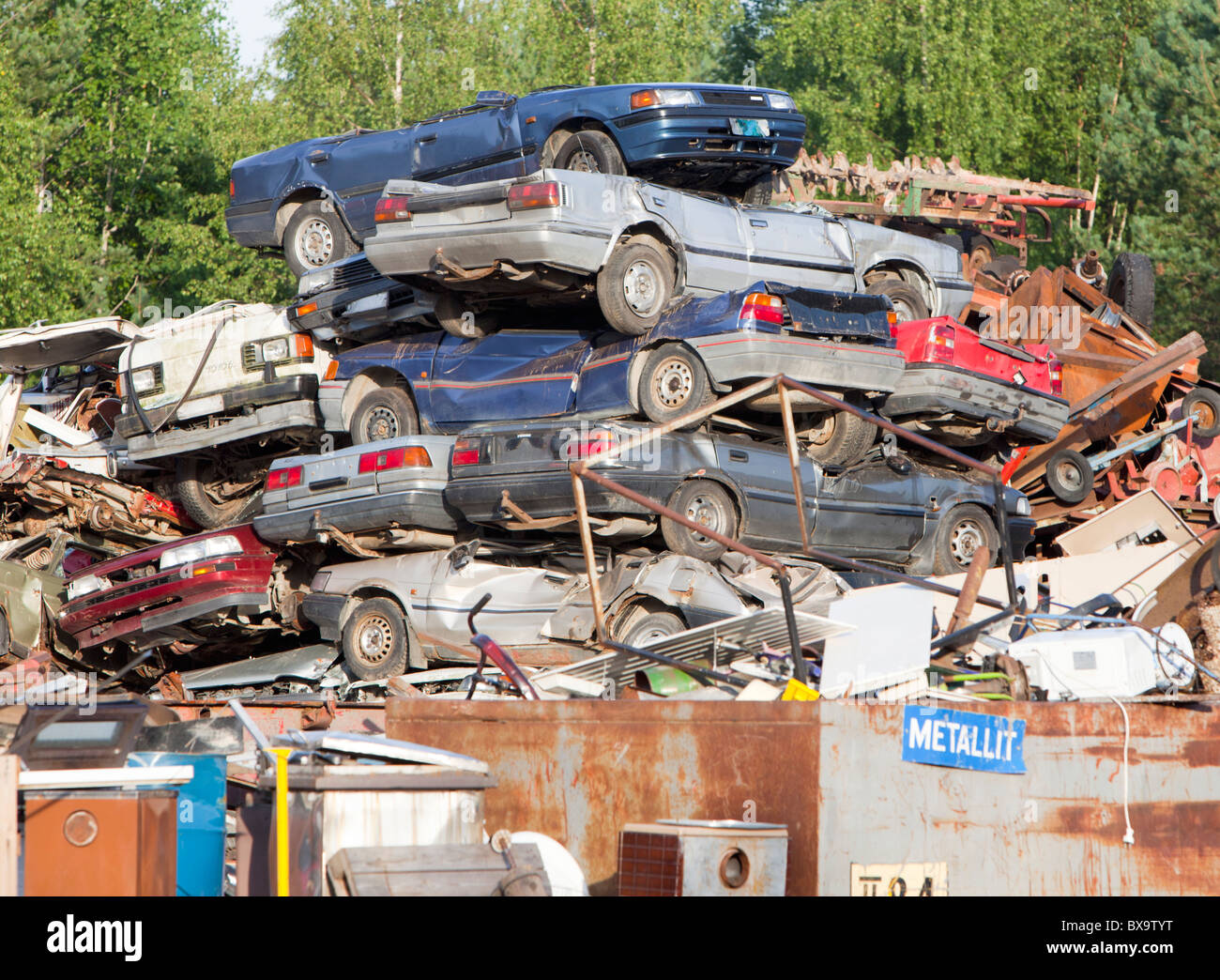 inventory pile of cars at scrapyard waiting for recycling , Finland Stock Photo