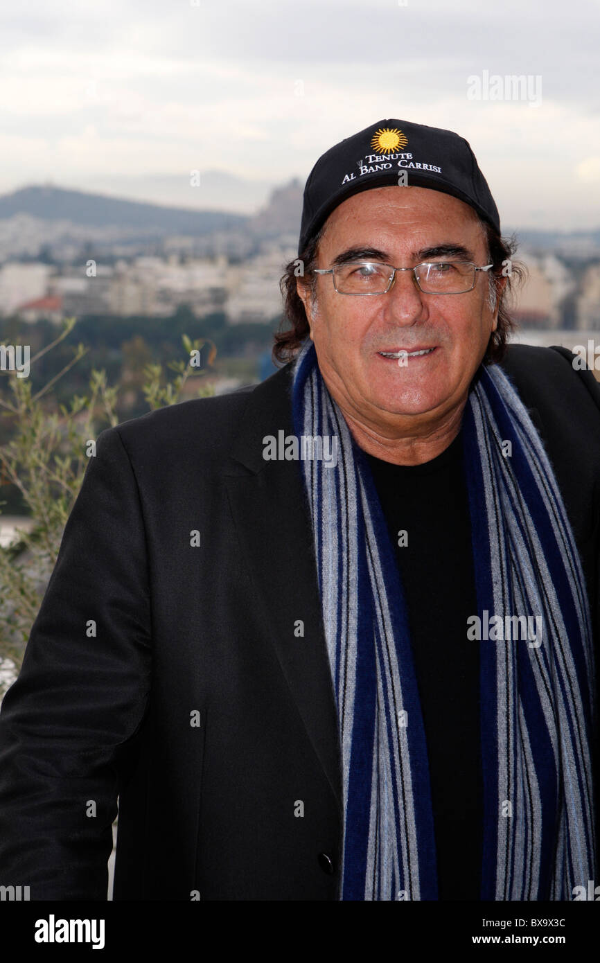 Italian singer ALBANO CARRISI(alone) and Greek singer YANNIS PLOUTARHOS present their new CD to the media at Hilton hotel with Acropolis behind him. Stock Photo