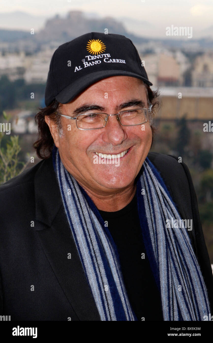 Italian singer ALBANO CARRISI(alone) and Greek singer YANNIS PLOUTARHOS present their new CD to the media at Hilton hotel with Acropolis in the background. Stock Photo