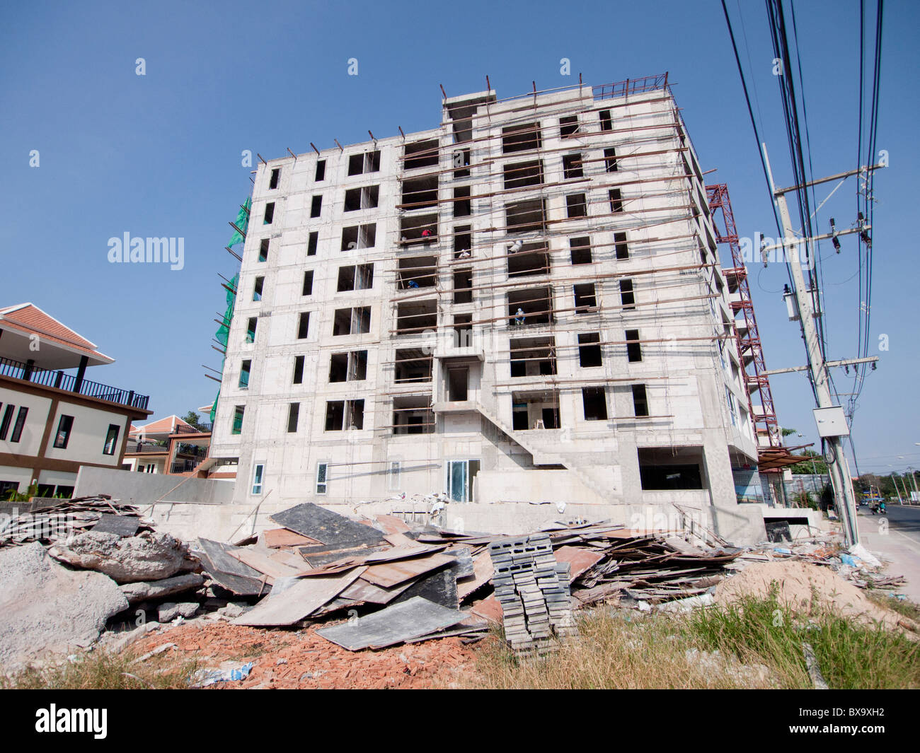 The unsafety construction site and no safety provided for the workers Stock Photo
