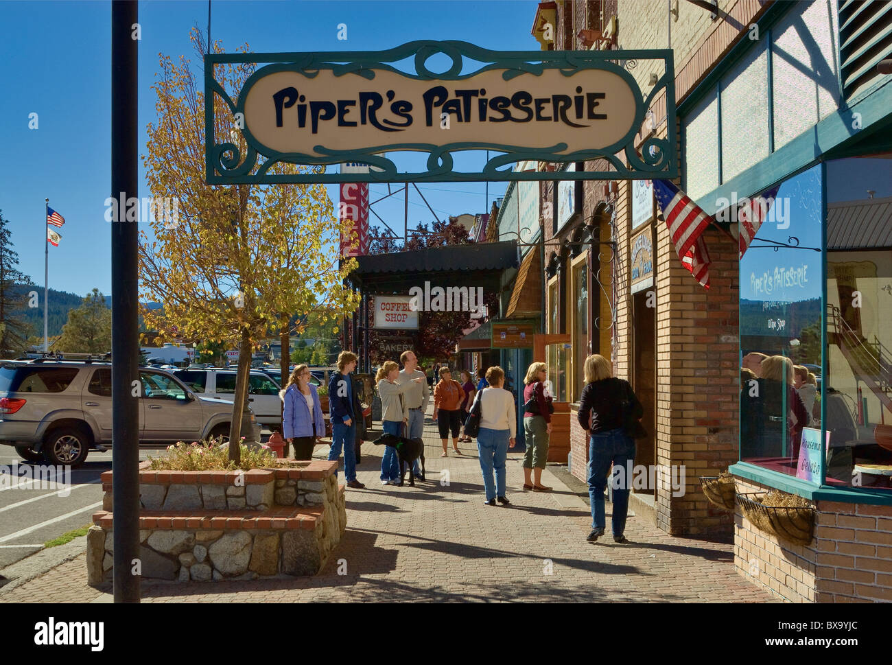 Art nouveau store sign, tourists at Commercial Row at Donner Pass Rd in Truckee, in northern Sierra, California, USA Stock Photo