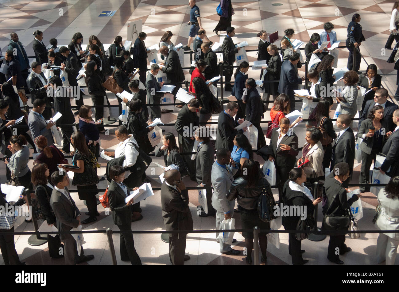 Job seekers attend the CUNY Big Apple Job Fair at the Jacob Javits